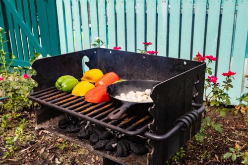 a grill with a bowl of vegetables on it at Steinhatchee River Inn and Marina in Steinhatchee