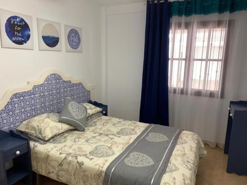 Posteľ alebo postele v izbe v ubytovaní Playa del Cura Paraiso