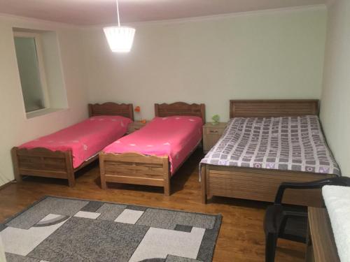 Postel nebo postele na pokoji v ubytování Mti House