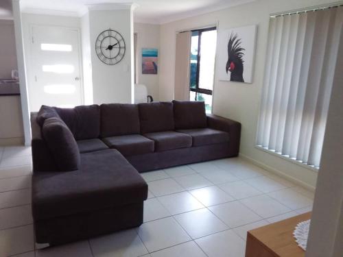 Zona de estar de Waratah and Wattle Apartments