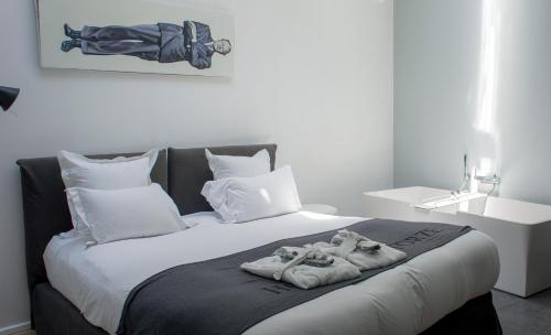 Säng eller sängar i ett rum på Hôtel Quatorze