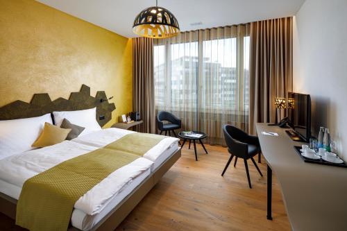 Postel nebo postele na pokoji v ubytování Focus Hotel