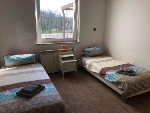 Кровать или кровати в номере Mühlwegunterkunft