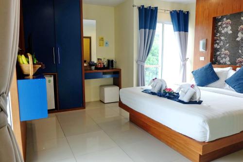 Voodi või voodid majutusasutuse Calypso Patong Hotel toas