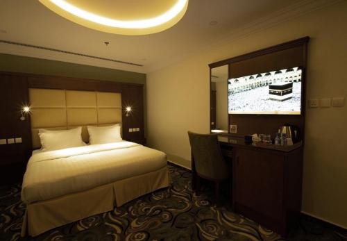 A bed or beds in a room at Rona Al Khobar Hotel