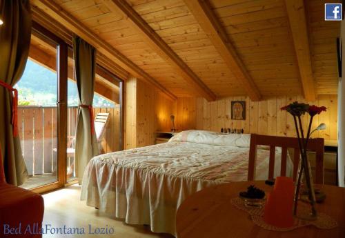 Postel nebo postele na pokoji v ubytování B&B Alla Fontana
