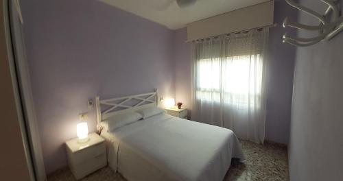 En eller flere senge i et værelse på Alicante & Urban Center