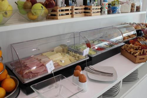 a display case in a store filled with food at Sicilia's Art Hotel & Spa in Acitrezza