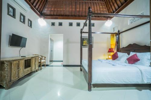 Postel nebo postele na pokoji v ubytování Jero Griya Ubud