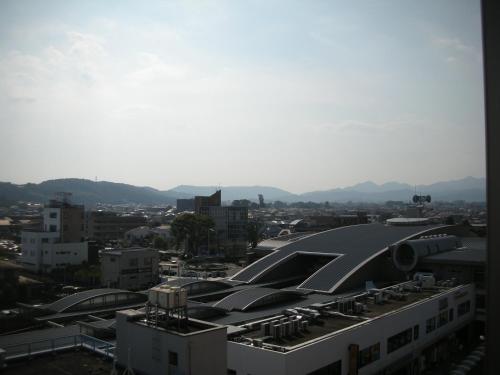 a view of a city with a building at Grand Hotel Kanachu Hadano in Hadano