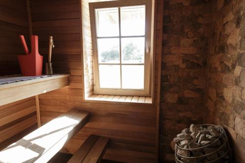 a room with a window and a wooden floor at Villa Bumba in Liigalaskma