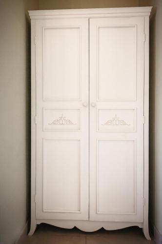 two white closet doors in a room at Avto Spa in Khmelʼnytsʼkyy