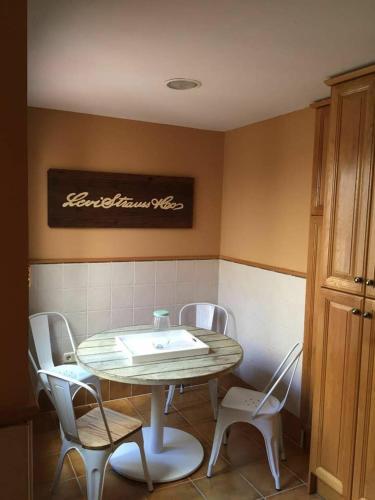 a table and chairs in a small room with a table and chairsktop at Martin Gamero Apartments in Toledo