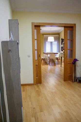a living room with a kitchen and a dining room at Martin Gamero Apartments in Toledo