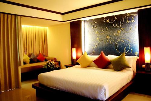 Voodi või voodid majutusasutuse Khaolak Orchid Beach Resort - SHA Extra Plus toas