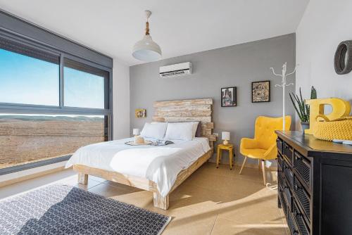 Postel nebo postele na pokoji v ubytování Mitzpush Premium Villa