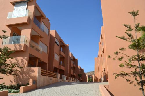 an empty street in front of a building at Plage de rêve in Imi Ouaddar