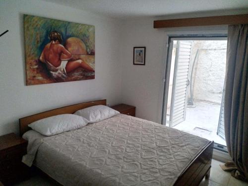 Posteľ alebo postele v izbe v ubytovaní Art apartment Syngrou