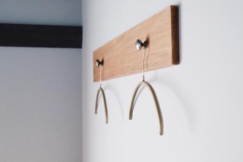 a pair of ear hooks hanging from a wall at Beppu hostel&cafe ourschestra in Beppu