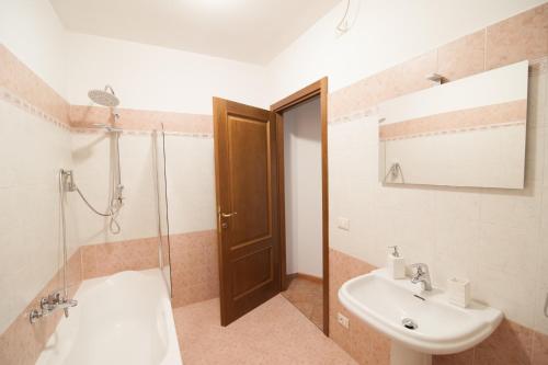a bathroom with a shower and a sink and a tub at B&B CA DEL SOLE in Serravalle Scrivia