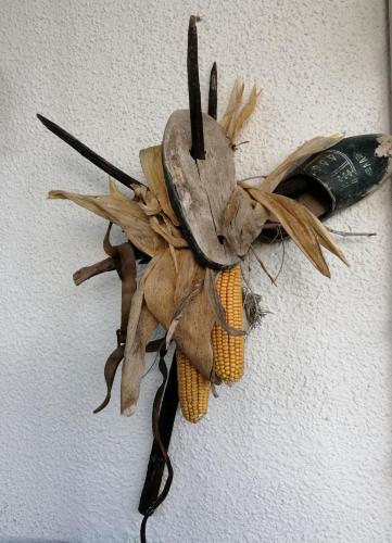 a decoration of a bird with corn on a wall at Apartments Krista in Seeboden