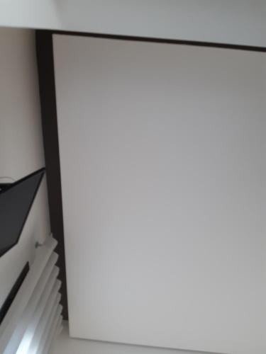 a room with a desk and a staircase at Patio 101 "Exclusive" in San Vito lo Capo