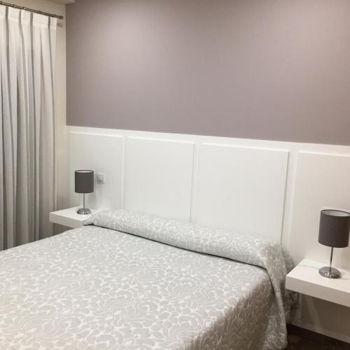 Ένα ή περισσότερα κρεβάτια σε δωμάτιο στο Hostal Infantes