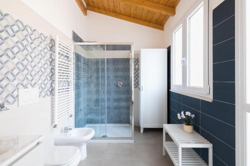 a bathroom with a toilet and a sink and a shower at Royal Piazza di Spagna in Rome