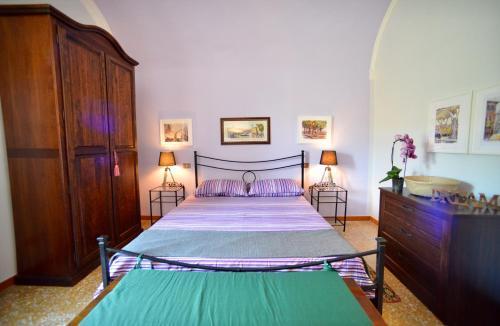 Säng eller sängar i ett rum på DOMUS EVA, dove è nata Tivoli