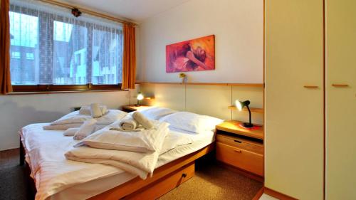 Ένα ή περισσότερα κρεβάτια σε δωμάτιο στο SKI - Apartment