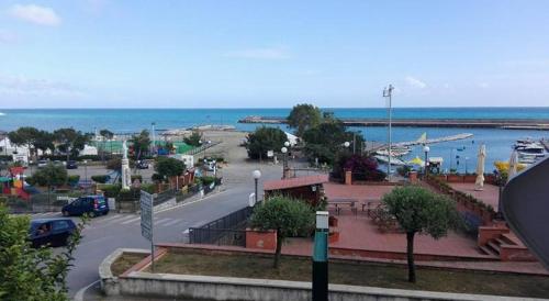 a view of a city with a harbor and the ocean at Casa Francesca in Marina di Camerota