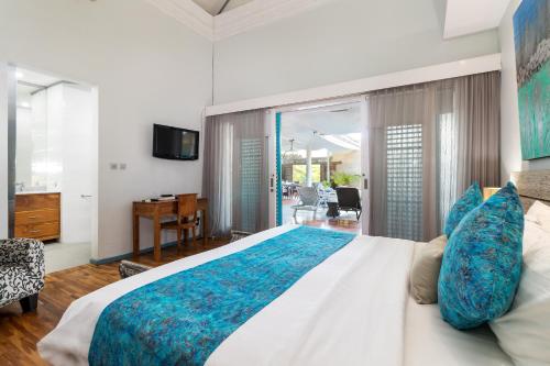 Ένα ή περισσότερα κρεβάτια σε δωμάτιο στο Pura Villa