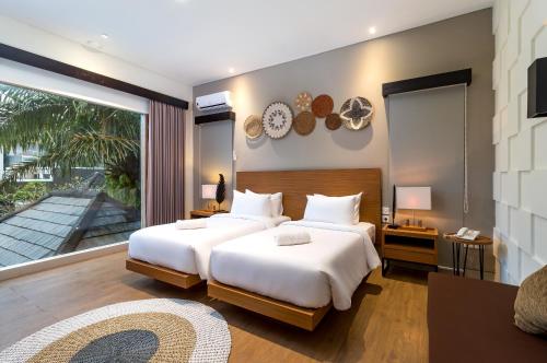 Postel nebo postele na pokoji v ubytování Annupuri Villas Bali