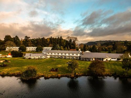 an aerial view of a large building next to a body of water at VR Rotorua Lake Resort in Rotorua