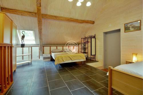 a large room with two beds and a window at LA FARIO 2 in Gavarnie