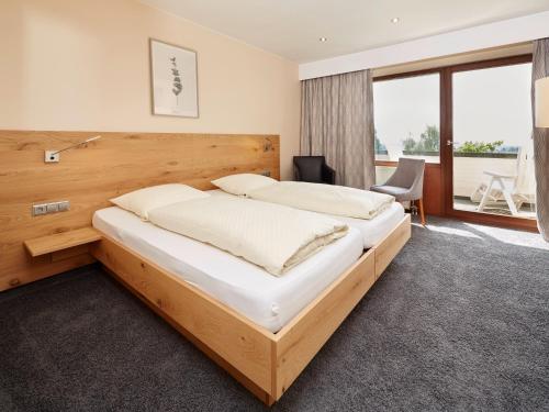 Llit o llits en una habitació de NaturKulturHotel Stumpf