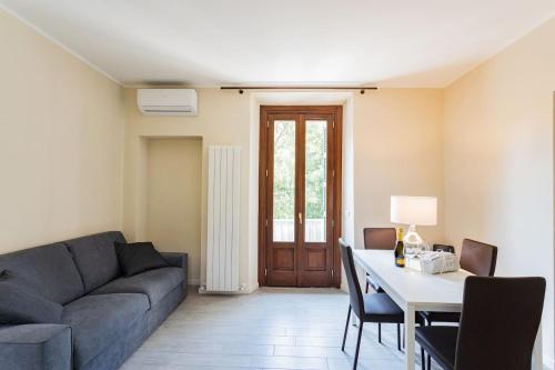 a living room with a couch and a table at Amazing Cernobbio - Lake Como by Rent All Como in Cernobbio