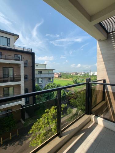 a balcony with a view of a building at Buluba - Dao Jia in Yuanshan