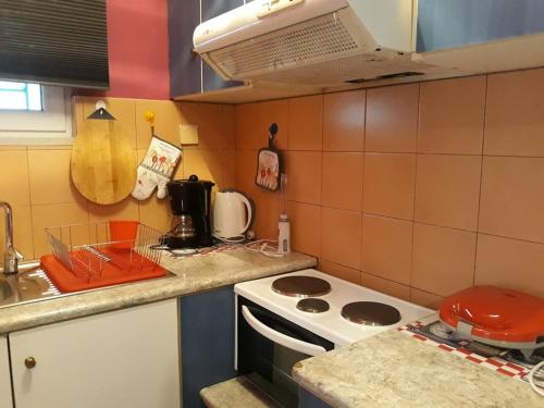 a kitchen with a stove and a counter top at The Best Offer in Preveza