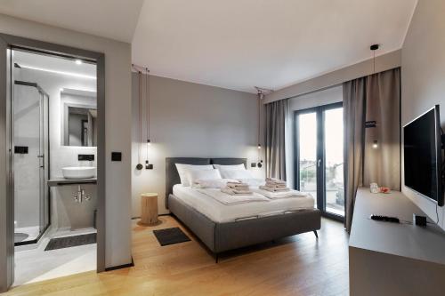 Postel nebo postele na pokoji v ubytování FourRoomotel