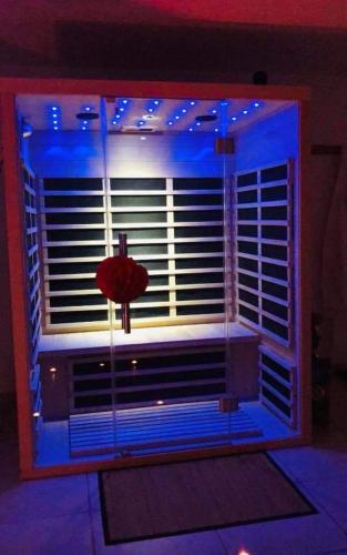 a window with blue lights in a room at Le Rêve d'une Nuit suite Venise in Forbach