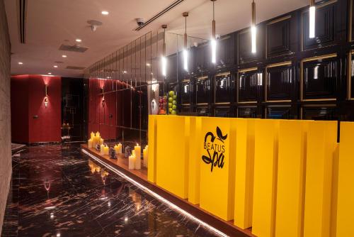 a room with a yellow counter with candles on it at Ramada Plaza By Wyndham Istanbul City Center in Istanbul