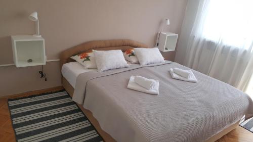 En eller flere senger på et rom på Apartma Sebastjan Dobova near Terme Paradiso