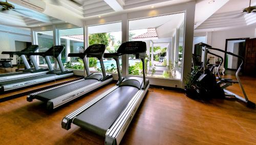 a gym with a row of treadles in a room at Memoire d' Angkor Boutique Hotel in Siem Reap