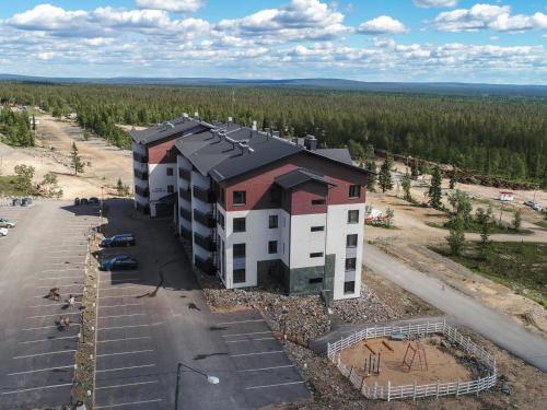 an aerial view of a building in a parking lot at Holiday Home Nordic chalet 9106 by Interhome in Ylläs