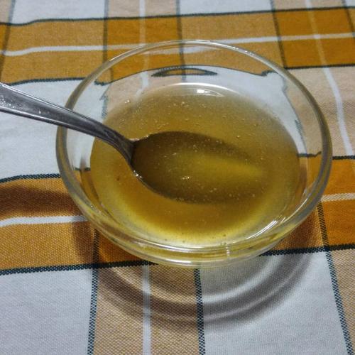 a glass bowl of liquid with a spoon in it at Agriturismo Bellavista in Arsita