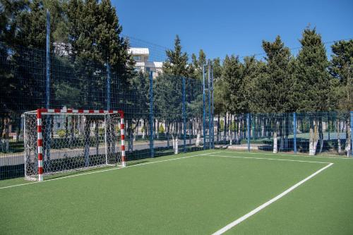 a tennis court with a net on a tennis court at Khazri in Baku