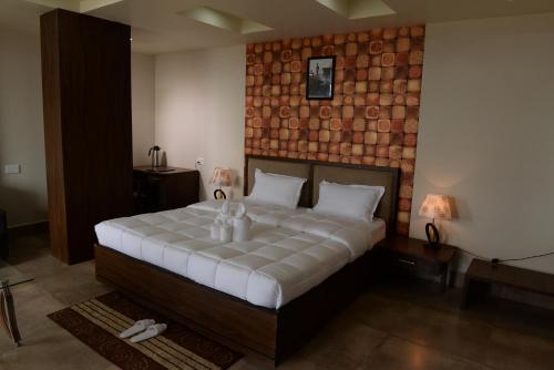 Ένα ή περισσότερα κρεβάτια σε δωμάτιο στο Hotel Lake Shilloi