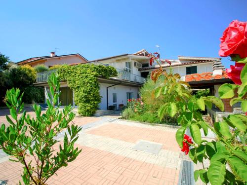 A garden outside Villa La Rosa by Interhome