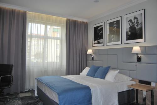 Cama o camas de una habitación en Hotel Włoski Italia Boutique Old Town Poznań